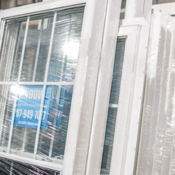 A window in a warehouse with a label on it.