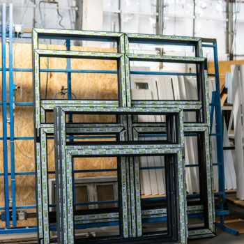 A group of windows in a warehouse.