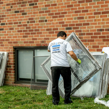 A man lifting a window.