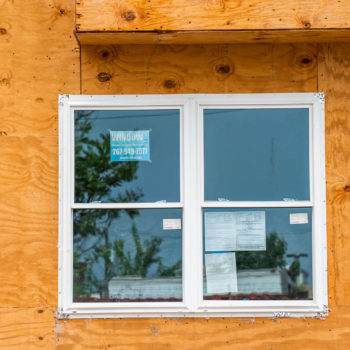 A window in a house that is under construction.