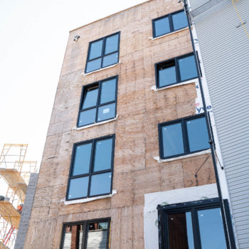 A building under construction with a lot of windows.