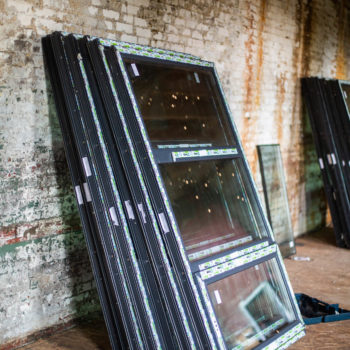 A group of windows in a brick building.