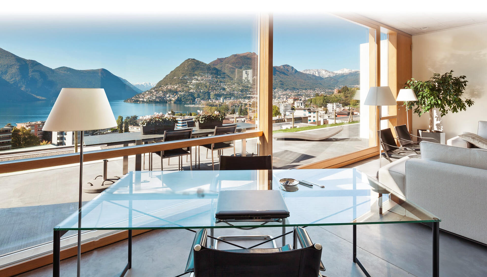 A living room with a view of lake como.